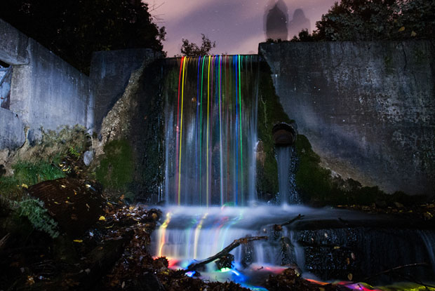 Colorful Long Exposure Photos of Glow Sticks Dropped Into Waterfalls glowwaterfall 4