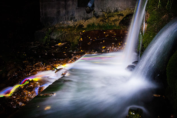 Colorful Long Exposure Photos of Glow Sticks Dropped Into Waterfalls glowwaterfall 2