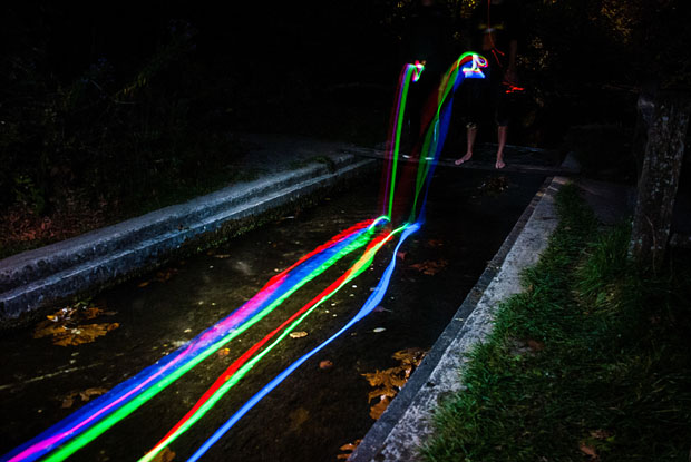 Colorful Long Exposure Photos of Glow Sticks Dropped Into Waterfalls glowwaterfall 3