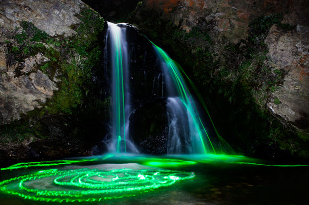 Colorful Long Exposure Photos of Glow Sticks Dropped Into Waterfalls glowwaterfall 5