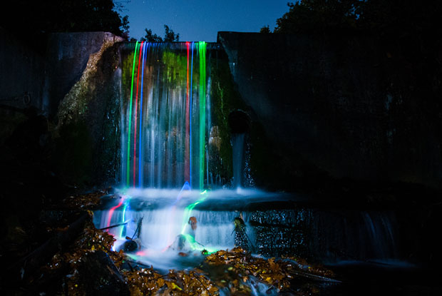 Colorful Long Exposure Photos of Glow Sticks Dropped Into Waterfalls glowwaterfall 6