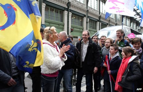 Leading activist Virginie Tellene, aka Frigide Barjot, greets protesters at the Gare de Lyon railway station in Paris, 26 May